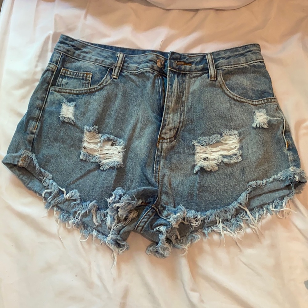 ripped light wash jean shorts